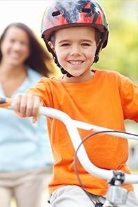 Young Boy Riding Bike